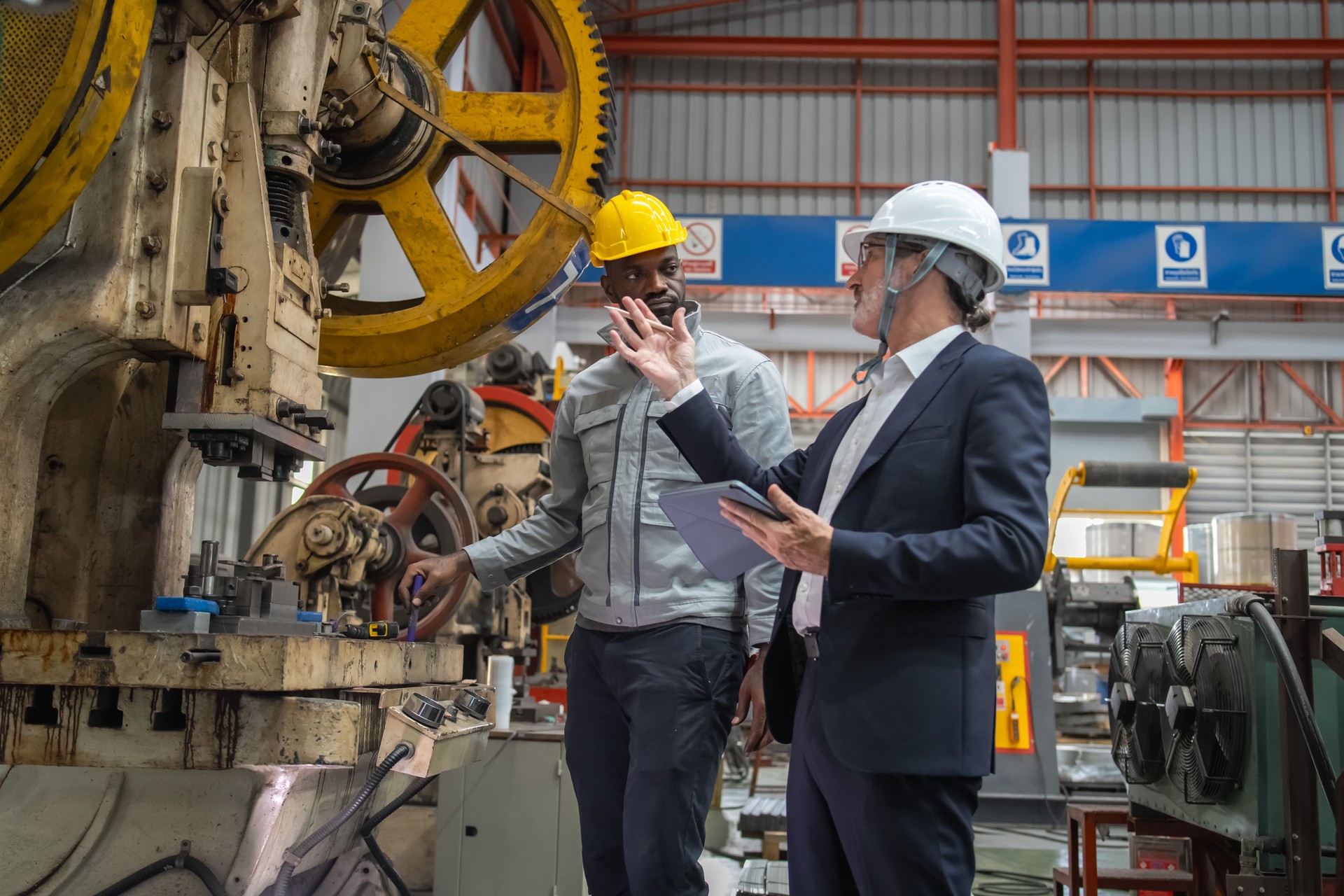 Business meeting highlights machinery operations manufacturing plant image showcase industrial environment on-site perspective